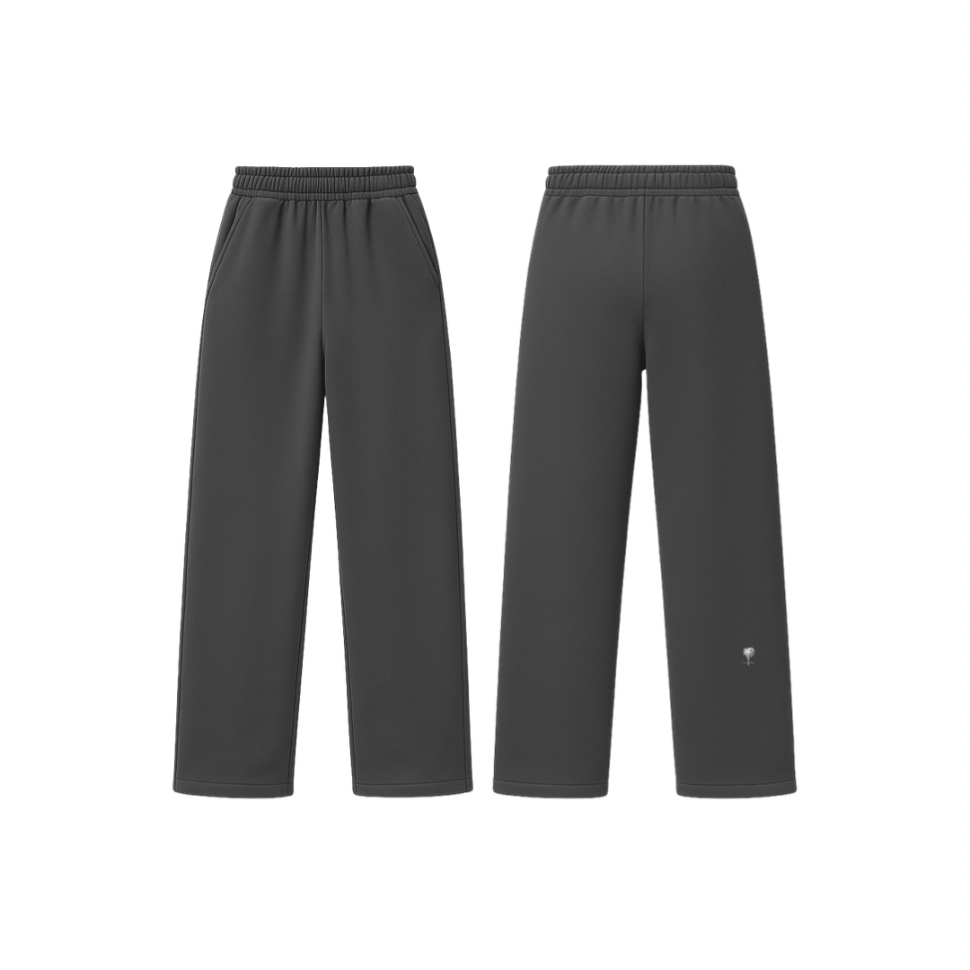 The Palm WarmFlex™ Pants in dark graphite gray — soft-touch wide-leg pants with an elastic waistband and relaxed silhouette, designed for warmth and everyday comfort. A clean, seamless look with subtle logo detailing.