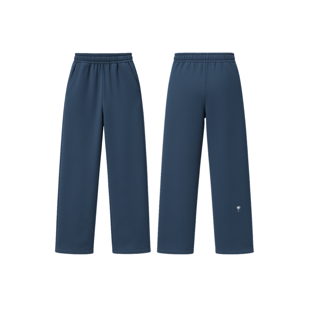 The Palm WarmFlex™ Pants in deep navy blue — soft-touch wide-leg pants with an elastic waistband and relaxed silhouette, designed for warmth and everyday comfort. A clean, seamless look with subtle logo detailing.